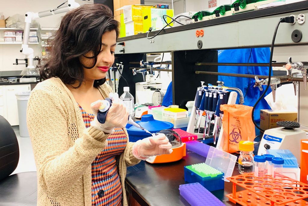 Akriti Shrestha working in lab