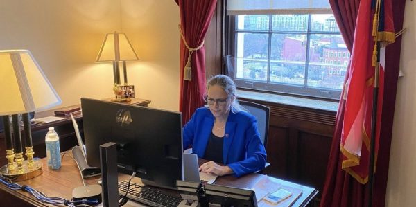 Carolyn Bourdeaux at her desk in her office