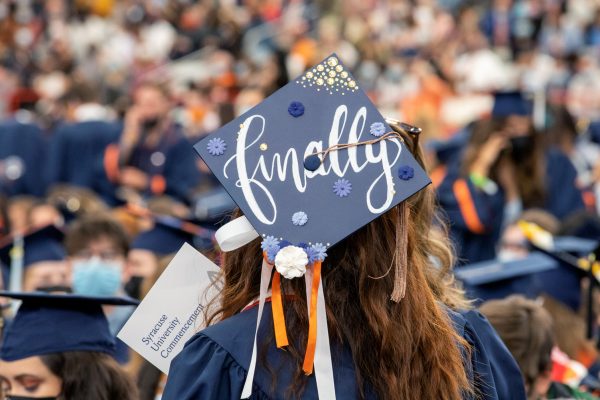 a mortarboard adorned with the word "Finally" on display at Commencement 2020