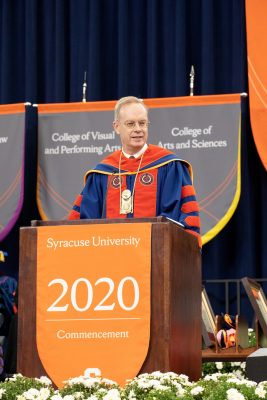 Chancellor Kent Syverud addresses the crowd from the podium at Commencement 2020