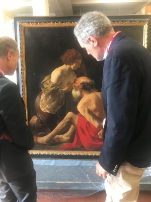 Wayne Franits and a colleague view a resurfaced painting from Hendrick ter Brugghen