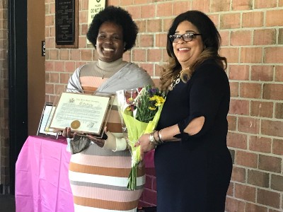 Assemblywoman Pamela J. Hunter presents Clarise Shelby-Coleman with an award and flowers