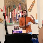 Poet Noel Quiñones reads at the 10th anniversary celebration of La Casita cultural center