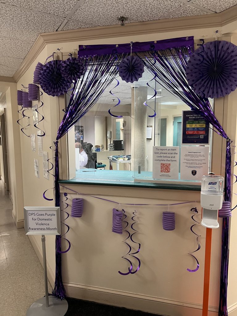 welcome desk with purple decorations