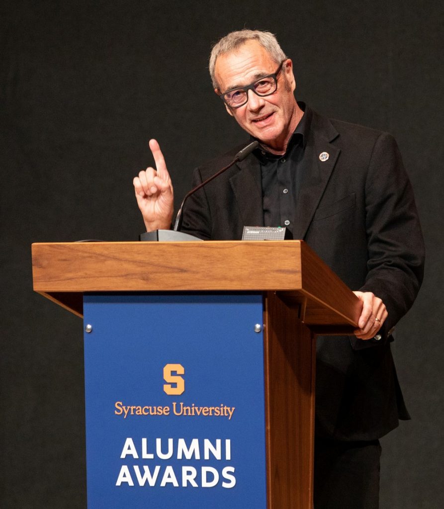  Jim Morris speaks at the podium during 2021 Alumni Awards at Orange Central