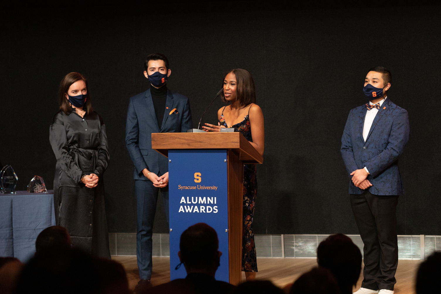 Katie Hoole, Ivan Robles, Nicole Osborne and Leo Wong on stage at the Alumni Awards during Orange Central 2021