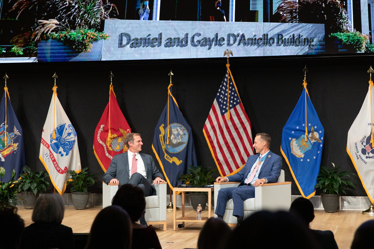 Mike Hayes and Britt Slabinski participate in a fireside chat at the dedication of the Daniel and Gayle D’Aniello Building, home of the National Veterans Resource Center