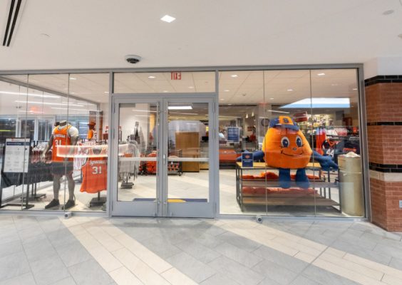 glass entryway to Campus Store showing clothing and other items
