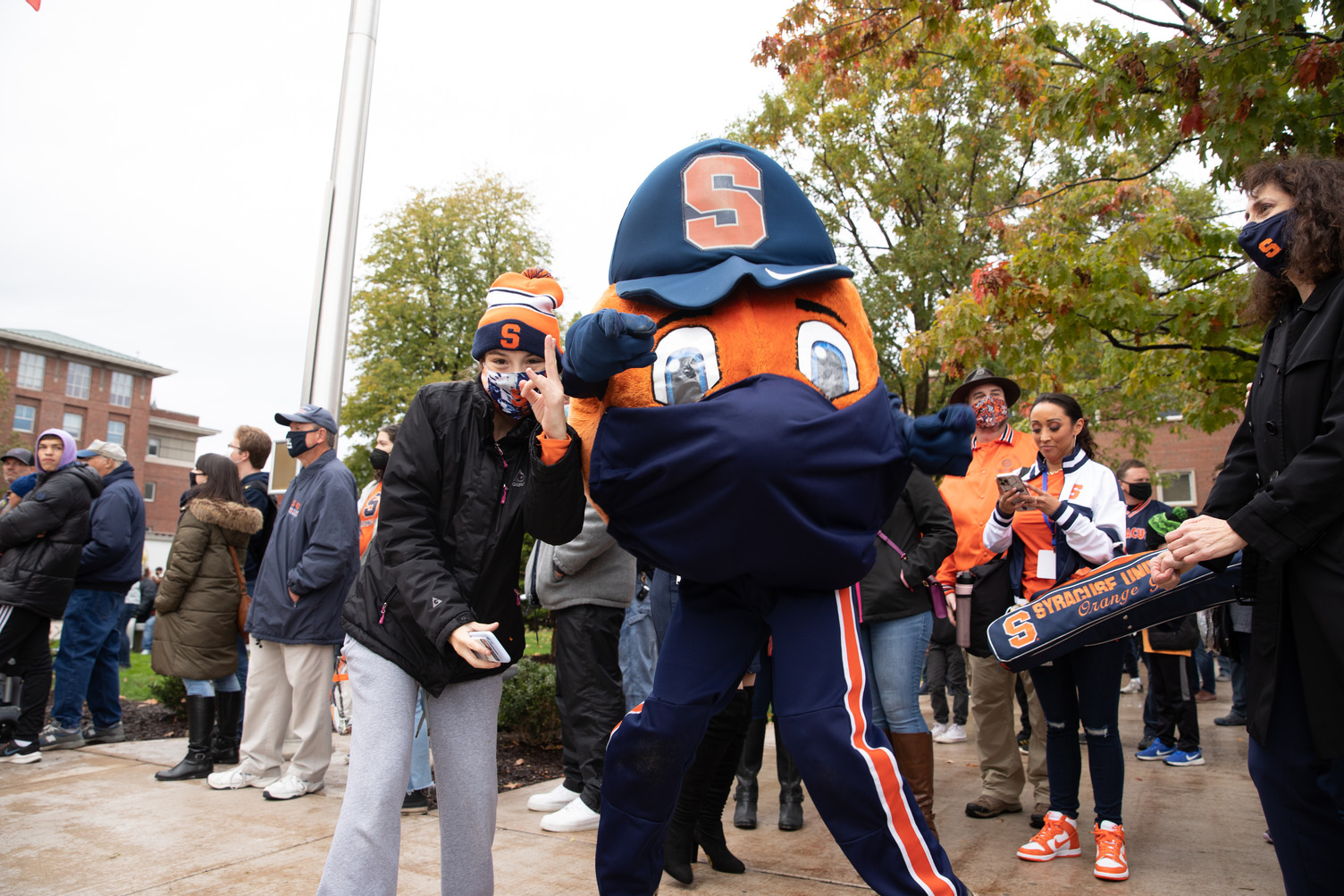 Otto poses with a young fan at the 2021 Orange Central tailgate celebration
