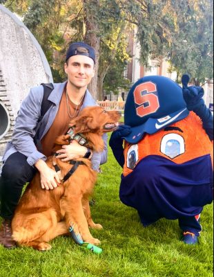 Ryan Austin Yon posing with his dog and Otto