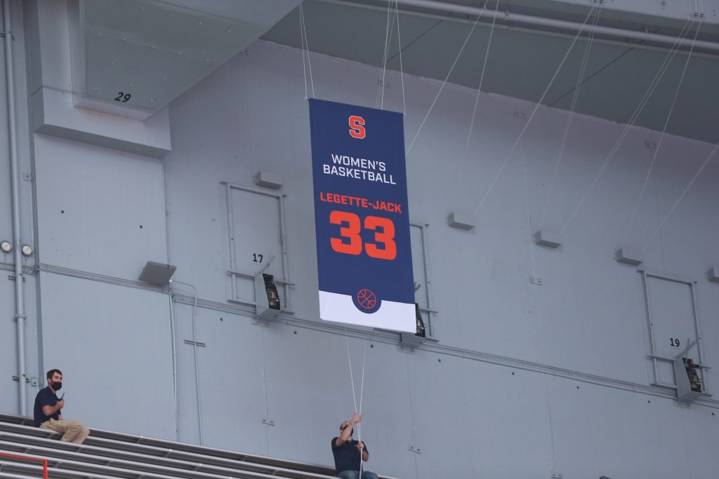 banner hanging from ceiling of stadium