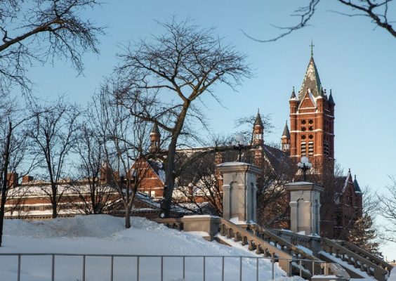 Morning light illuminates Crouse College and the Gateway to Campus on a winter day