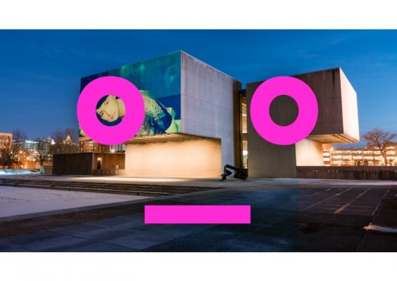 a film is projected on the Everson Museum of Art building