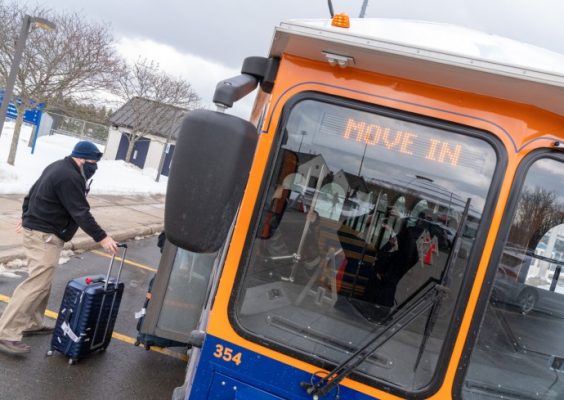person waits to board the Cuse Trolley during move-in for the Spring 2021 semester
