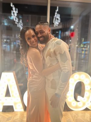 Ashleigh Mann and Quentin Brunson pose together at their engagement party