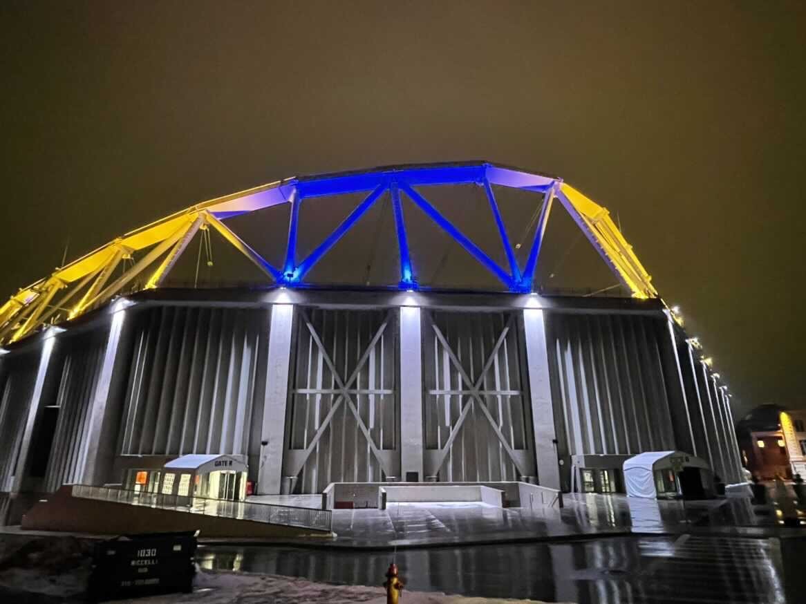 stadium lit up in blue and yellow