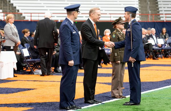 Chancellor Syverud shaking hands with cadet