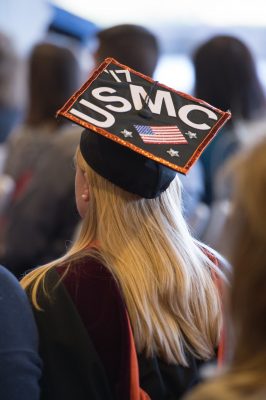 a graduate's cap with the letters USMC '17 and the American flag