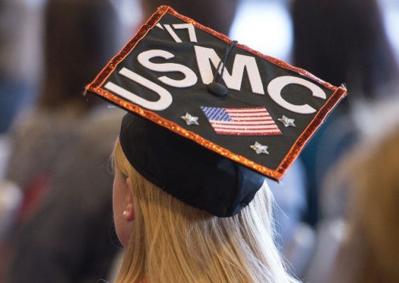 a graduate's cap with the letters USMC and the American flag
