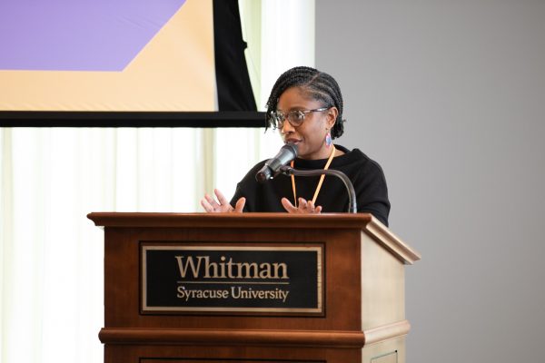 Marcelle Haddix speaks at the podium during the Social Differences, Social Justice Research Symposium