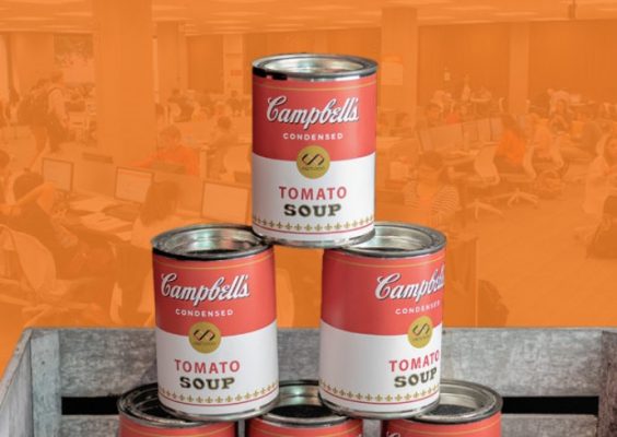 three cans of tomato soup stacked