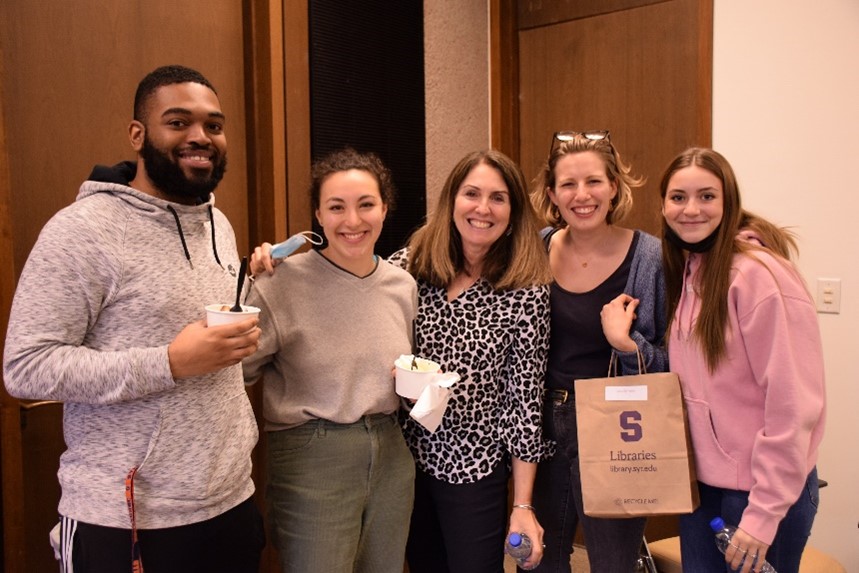 four student employees at the Libraries' Preservation Department pose with their supervisor during the Student Employee Awards