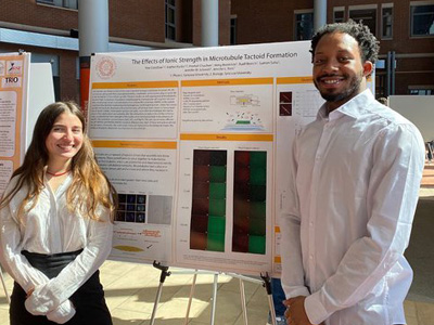 students Sophia Martin and Niaz Zaid displaying a poster on The Effect of Ionic Strength in Microtubule Tactoid Formation at the A&S Undergraduate Research Festival