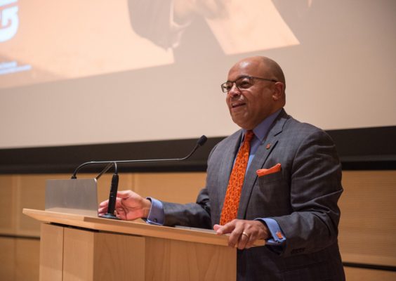 Mike Tirico '88 speaks at a podium