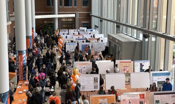 wide view of students, faculty, staff and visitors milling about at the A&S Undergraduate Research Festival held in the Life Sciences Complex