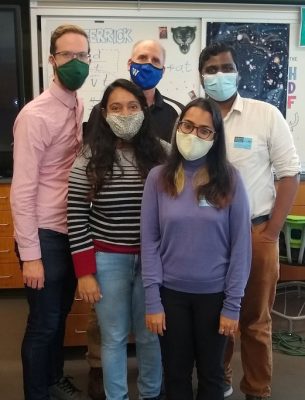 Physics graduate students Merrill Asp (left) and Sarthak Gupta (right) at an outreach event at Westhill High School in Syracuse.