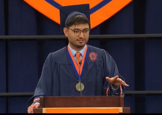 student speaking on Commencement stage