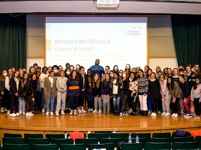 NBA player Michael Kidd-Gilchrest with students