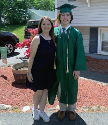 Carrie Grogan Abbott poses with her nephew Michael Gigliotti in his cap and gown