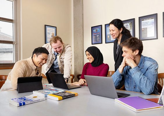 people around laptop