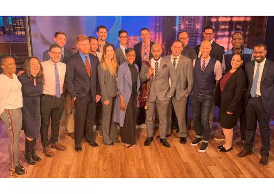 group of SU-affiliated people gather at a career immersion event
