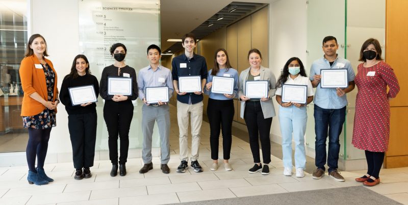 several students with certificates for poster and talk awards