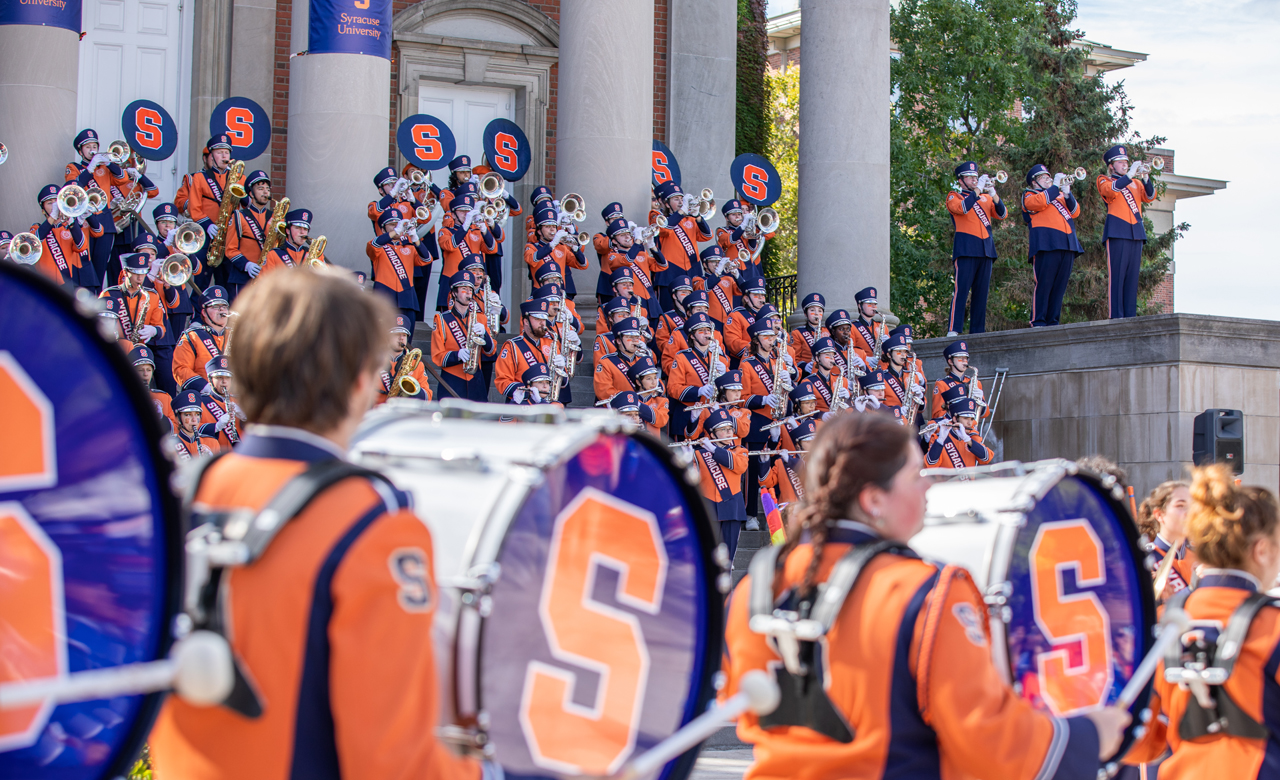 Marching band members play during Orange Central.
