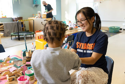 Emily LIu working with student