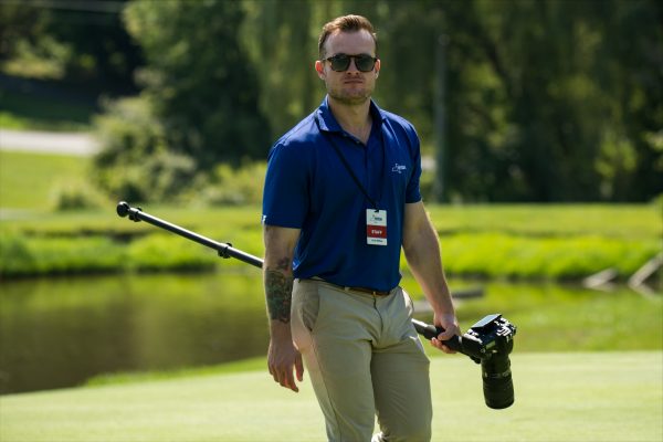 Fred Wilkes works at golf course during summer internship