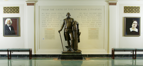 statue of George Washington in Maxwell Hall between portraits of Frederick Douglass and Susan B Anthony
