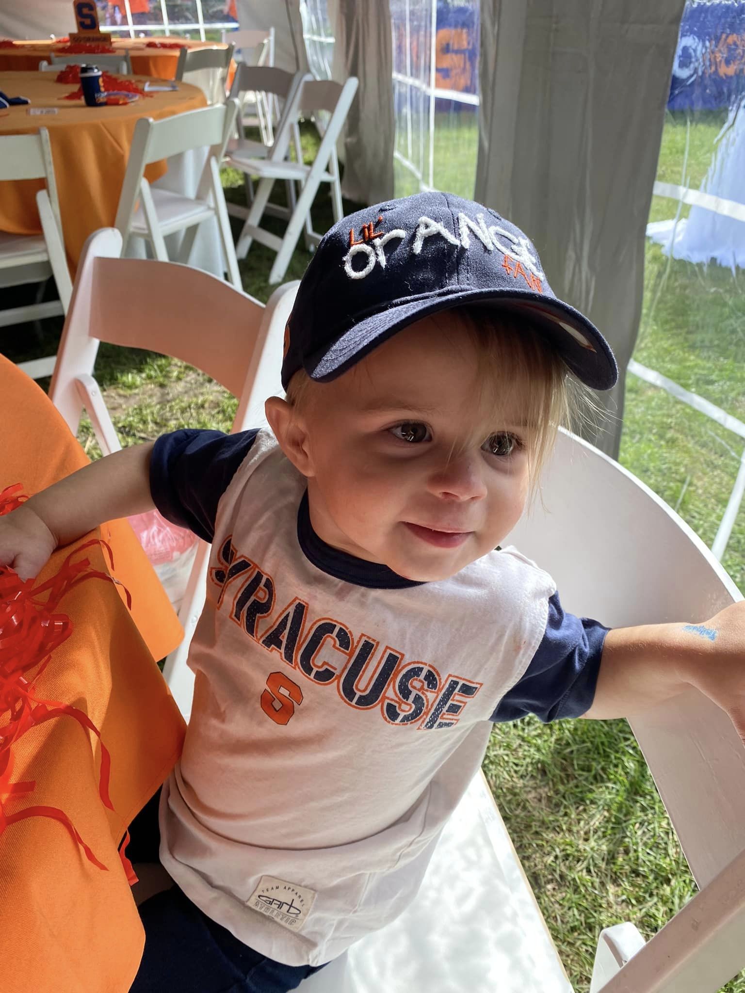 A young Syracuse University fan poses during the Orange Central Tailgate