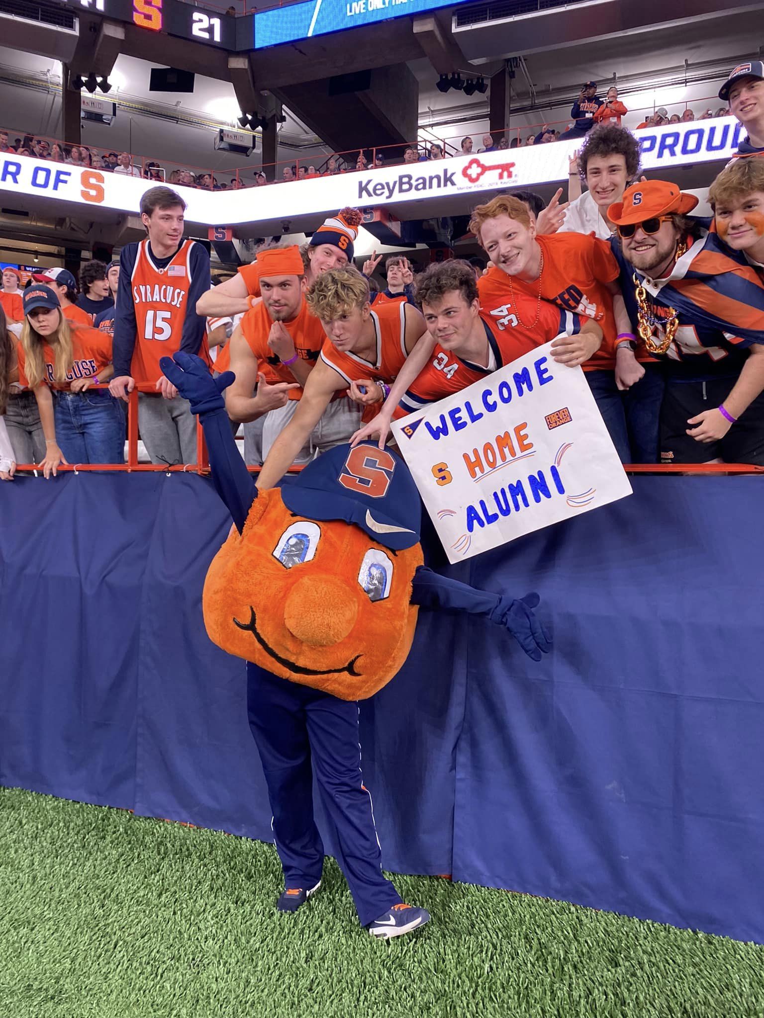 Otto poses with students during the football game.