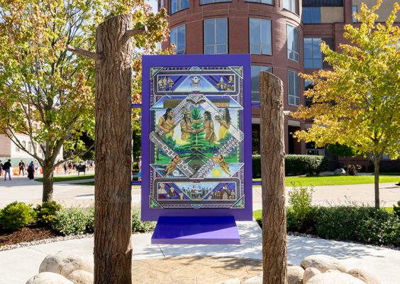 the painting “Gayaneñhsä•ʔgo•nah" which is dedicated to Haudenosaunee cultures, origins and influence, is affixed to two white pine logs on Shaw Quadrangle