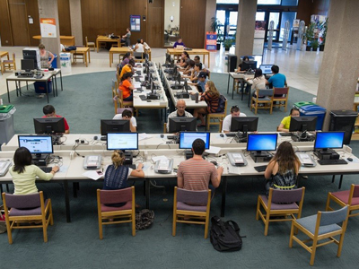 Students studying inside a library.