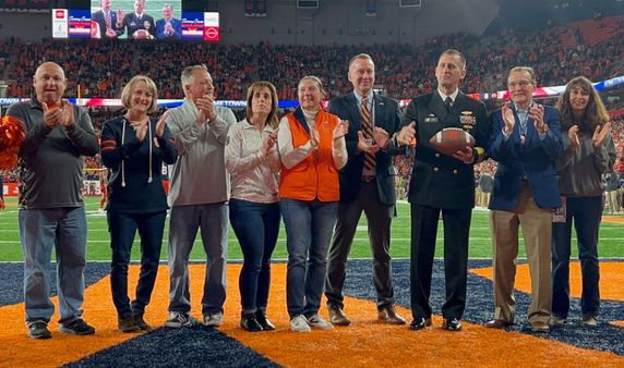 Members of the Syracuse University community on the field at the Orange Football game Nov. 12
