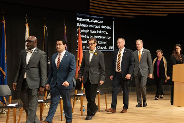 University representatives file onto the stage at the 2022 Veterans Day Ceremony