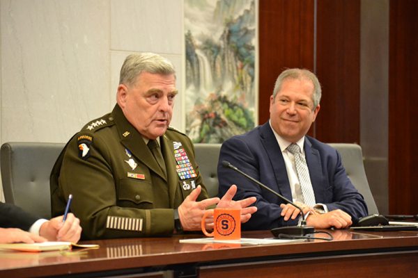 U.S. Army General Mark Milley speaking while seated next to Mark Jacobson