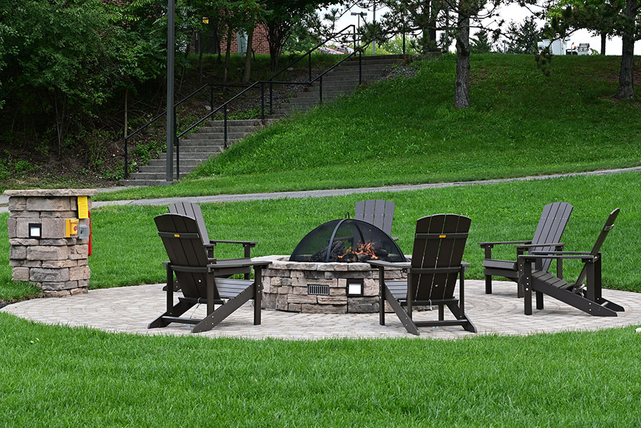 fire pit surrounded by chairs on South Campus