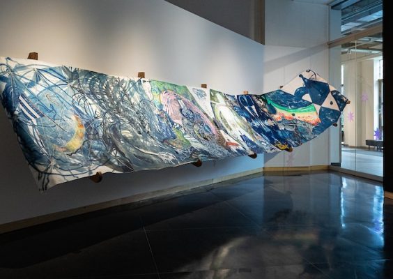 long rolling artwork of blue colors displayed along the wall