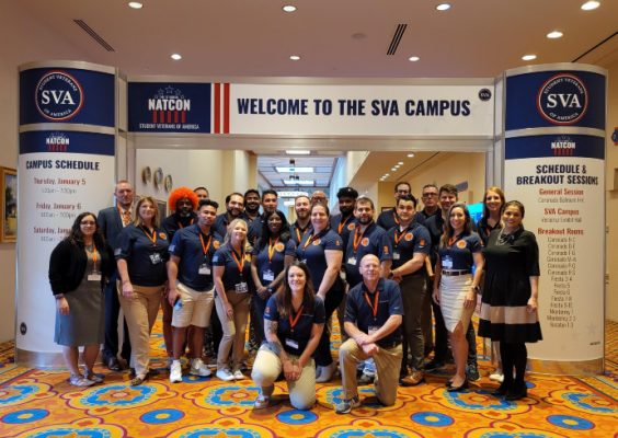 group of people standing in front of sign that says Welcome to the SVA Campus